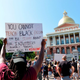 Protesters gather at the State House during a Juneteenth protest and demonstration in honor of Rayshard Brooks and other victims of Police Violence in Boston, Massachusetts on June 22, 2020.